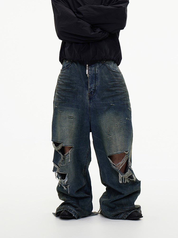 ASTT 24S/S erosion mud dyed old knife cut tear irregular damage mopping Paris denim trousers trend