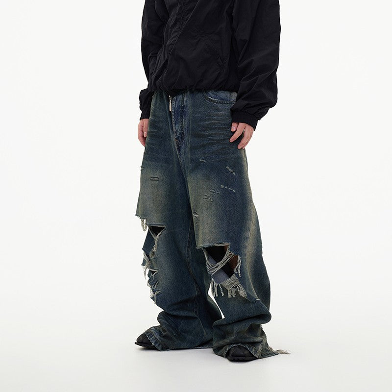 ASTT 24S/S erosion mud dyed old knife cut tear irregular damage mopping Paris denim trousers trend